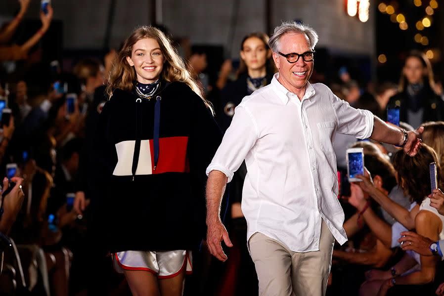 Gigi Hadid and Tommy Hilfiger on the runway together. Photo: Getty Images.