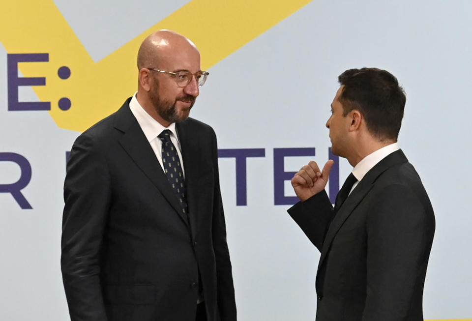 Ukrainian President Volodymyr Zelenskyy, right, and European Council President Charles Michel talks during the Crimean Platform Summit in Kyiv, Ukraine, Monday, Aug. 23, 2021. The Crimea Platform is a new international consultation and coordination format to strengthen an international response to the ongoing Russia's occupation of Crimea. (Ukrainian Presidential Press Office via AP)