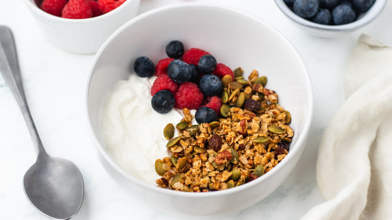 Granola in bowl with berries and yogurt