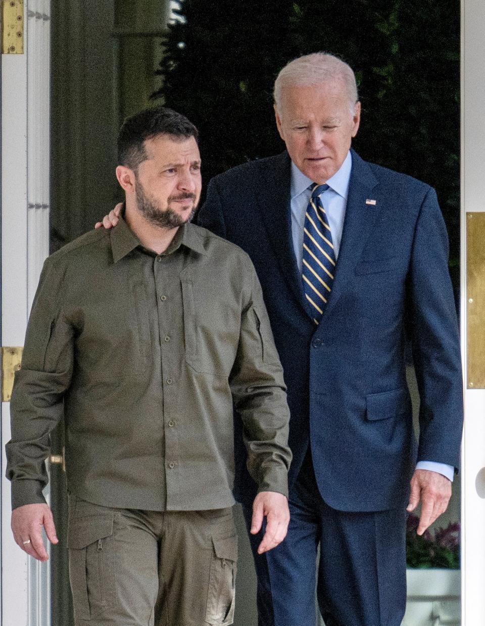 US President Joe Biden and Ukrainian President Volodymyr Zelenskiy walk through the colonnade to the Oval Office at the White House in Washington, DC, in September (via REUTERS)