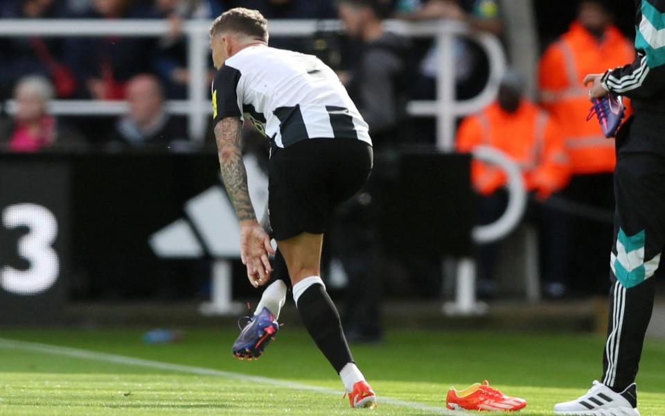 Newcastle, Britain - September 28, 2024 Newcastle United's Kieran Trippier changes his boots during the match