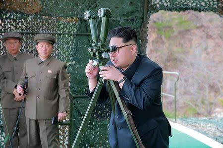 North Korean leader Kim Jong Un guides on the spot the underwater test-fire of strategic submarine ballistic missile in this undated photo released by North Korea's Korean Central News Agency (KCNA) in Pyongyang on April 24, 2016. KCNA/via REUTERS/Files