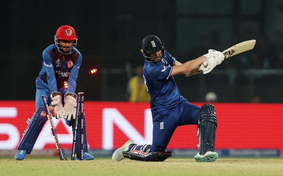 England's innings comes to an end when Mark Wood is bowled by Rashid Khan