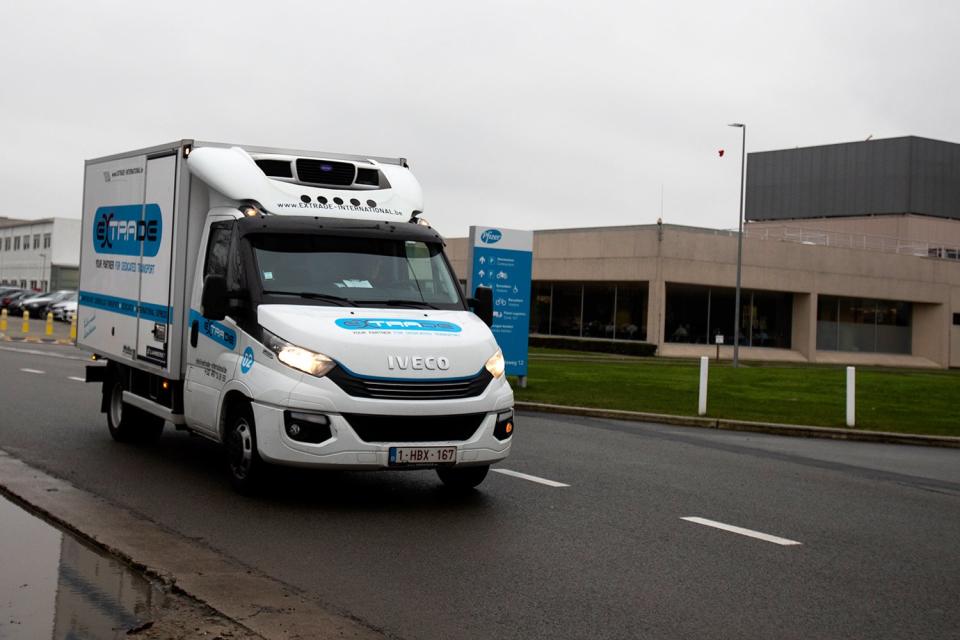 <p>A refrigerated truck leaves the Pfizer Manufacturing plant in Puurs, Belgium</p> (AP)