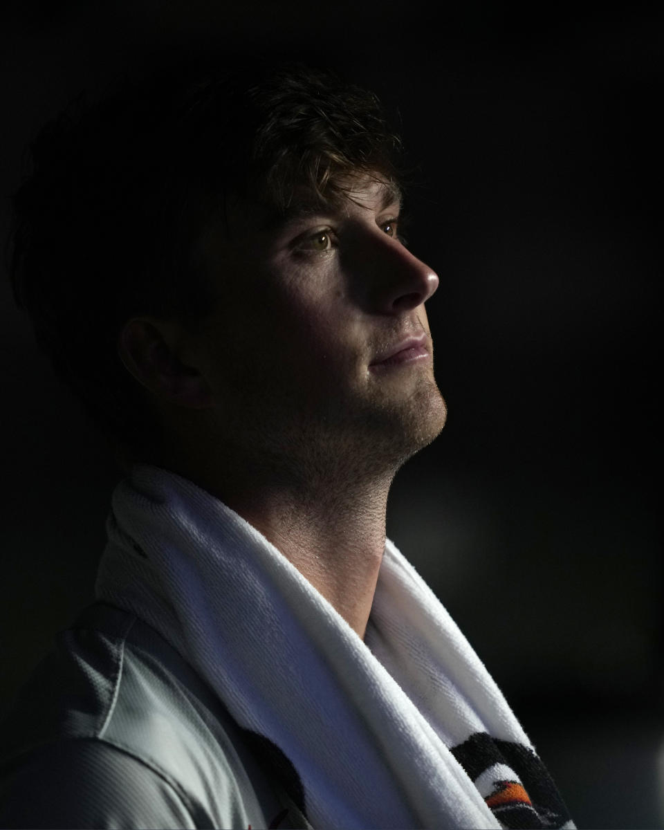 Philadelphia Phillies starting pitcher Michael Mercado looks out from the dugout during the fifth inning of a baseball game against the Chicago Cubs Tuesday, July 2, 2024, in Chicago. (AP Photo/Charles Rex Arbogast)