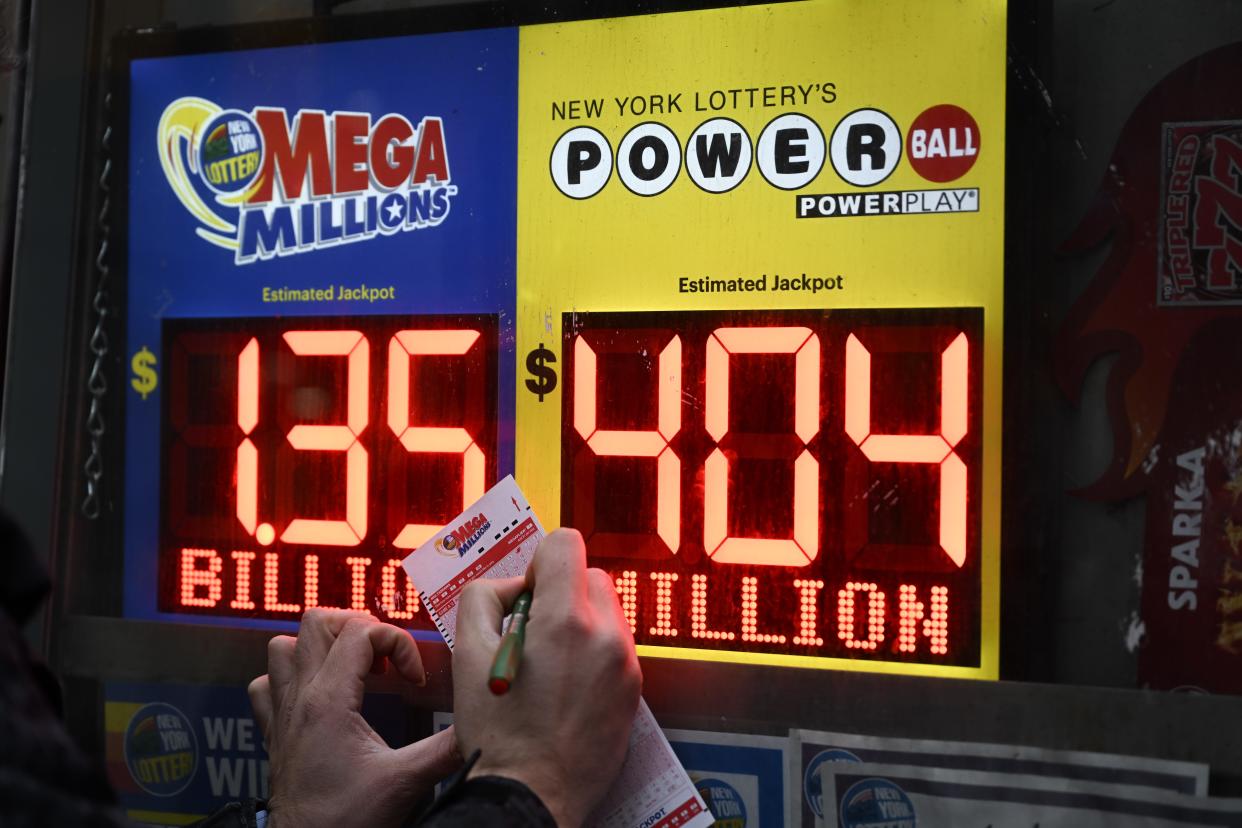 Mega Millions sign and lottery tickets are seen at a store in New York, United States on January 12, 2023.