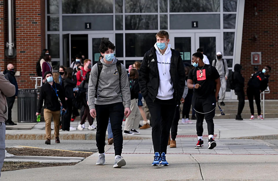 Students leave Framingham High School after the final bell on March 3, 2021. On that day, the district officially shifted into a full hybrid model and more students returned to some in-person learning.