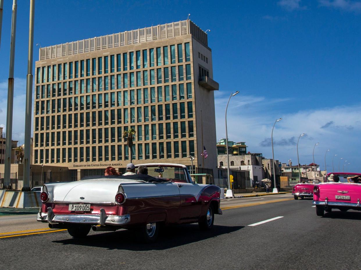 <p>Tourists ride classic convertible cars on the Malecon beside the United States Embassy in Havana, Cuba</p> (AP)