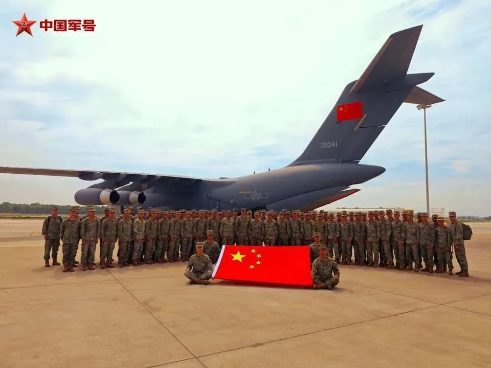 PLA troops after disembarking from a Y-20 strategic transport aircraft. <em>Chinese state media via X</em>