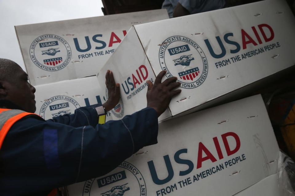 Workers unload medical supplies to fight the Ebola epidemic from a USAID cargo flight on Aug. 24, 2014 in Harbel, Liberia. (Photo by John Moore/Getty Images)