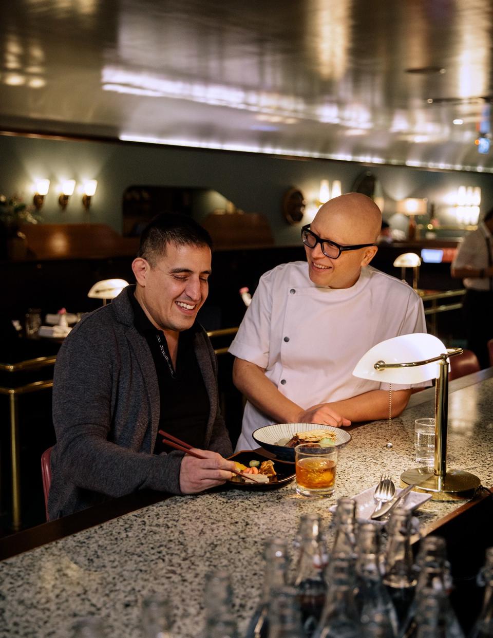 <cite class="credit"><em>Photo by Grant Harder</em> | Chef Jefferson Alvarez and chef Joël Watanabe at Kissa Tanto</cite>