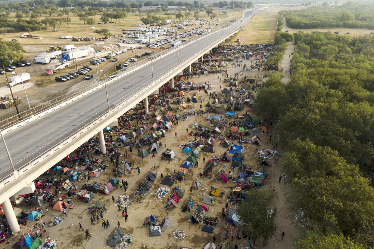 Image: Migrants, many from Haiti, at an encampment along the Del Rio International Bridge near the Rio Grande, in Del Rio, Texas, on Sept. 21, 2021. (Julio Cortez / AP file)