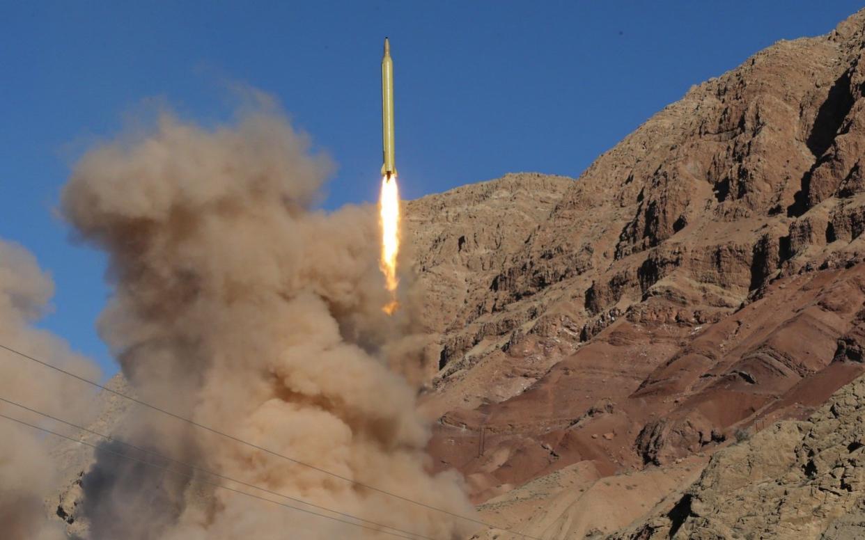 A long-range Qadr ballistic missile is launched in the Alborz mountain range in northern Iran on March 9, 2016.  - AFP