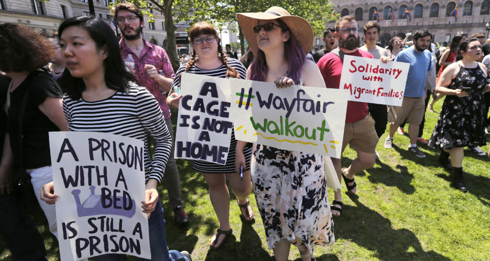 Employees of Wayfair march to Copley Square in protest prior to their rally in Boston, Wednesday, June 26, 2019. Employees at online home furnishings retailer Wayfair walked out of work to protest the company's decision to sell $200,000 worth of furniture to a government contractor that runs a detention center for migrant children in Texas. (AP Photo/Charles Krupa)