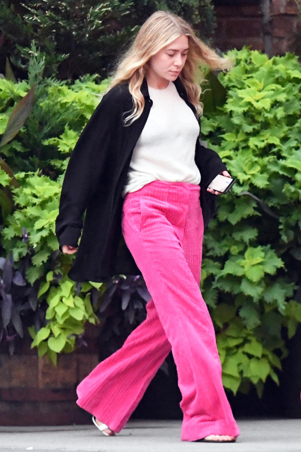 The famous twin exited her N.Y.C. hotel in a pair of bold trousers.