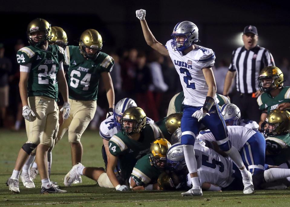 Olentangy Liberty's Alex Okuley celebrates after a fourth-down stop against Dublin Jerome during a Division I regional quarterfinal Nov. 4.