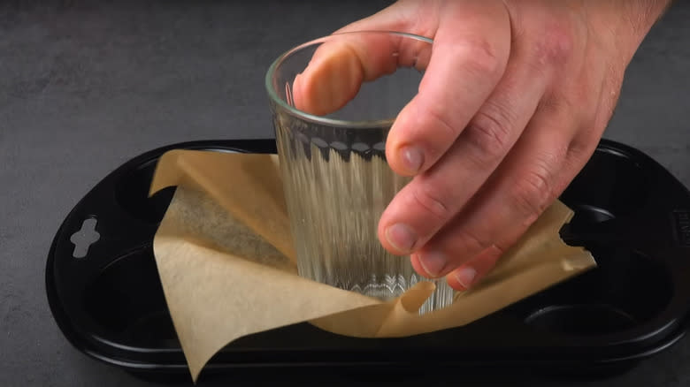 Glass pressing down cupcake liner