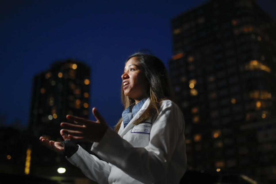 CORRECTS SPELLING TO DOOBAY INSTEAD OF DOOBEY ON SECOND REFERENCE - Kamini Doobay, an Emergency Medicine Resident physician at NYU Langone Medical Center and Bellevue Hospital, talks during an interview about her experiences treating COVID-19 patients, Thursday, March 26, 2020, in New York. As an emergency medicine physician in New York City, Dr. Doobay has always known that death is part of the territory in trying to care for the city's sickest. But it hasn't been like this _ patients stricken with coronavirus, on ventilators, and no visitors allowed because of strict protocols to prevent its spread. (AP Photo/John Minchillo)