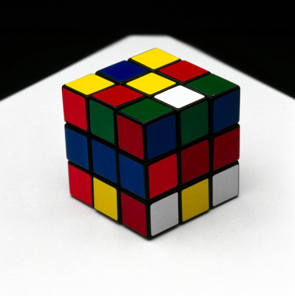 Rubik's Cube partially solved on a reflective surface