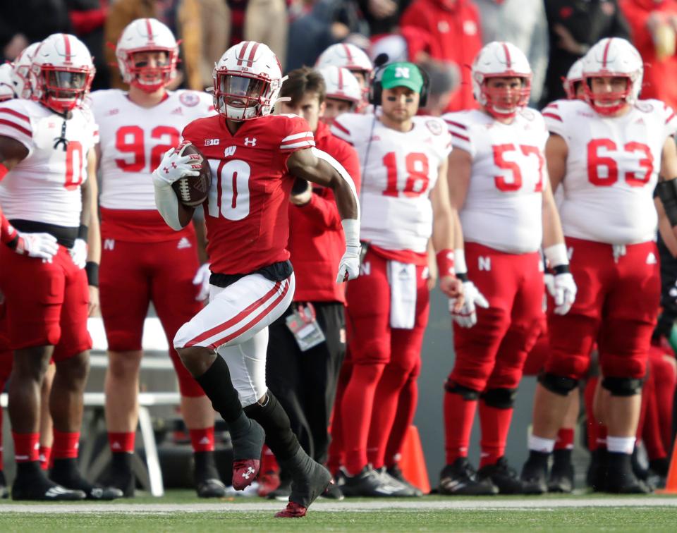 Wisconsin Badgers wide receiver Stephan Bracey (10) runs back the opening kick-off 91-yards for a touchdown against Nebraska during their football game Saturday, November 20, 2021, at Camp Randall in Madison, Wis.