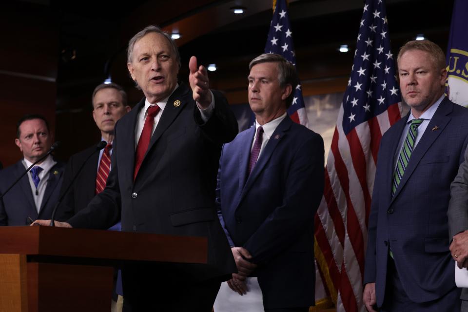 U.S. Rep. Andy Biggs, R-Ariz., speaks as (L-R) Rep. Eric Burlison, R-Mo., Rep. Scott Perry, R-Pa., Rep. Barry Moore, R-Ala., and Rep. Warren Davidson, R-Ohio, listen during a news conference at the U.S. Capitol on February 13, 2024 in Washington, DC.