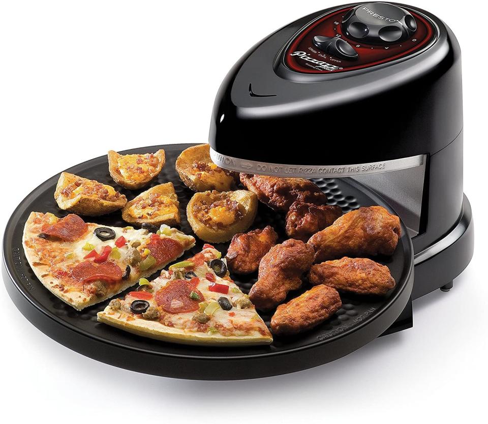 Great for reheating last night's leftover slices if you're not a cold pizza kinda person.<br /><br /><strong>Promising Review:</strong> "I bought this to cook 'take and bake' pizza in motel rooms. I first started it up and made toast, another difficult thing to do on the road. It worked great! My wife and I make pizza from scratch about once a week and we eat the leftovers for lunch during the week. This turned out to be the best pizza warming device we have ever tried. It now has a home on the counter and is used several times a week." &mdash;<a href="https://www.amazon.com/gp/customer-reviews/RQDXLGHPP1CN?&amp;linkCode=ll2&amp;tag=huffpost-bfsyndication-20&amp;linkId=ef9f943d9647263e04021175632416c7&amp;language=en_US&amp;ref_=as_li_ss_tl" target="_blank" rel="noopener noreferrer">dstabq</a><br /><br /><strong>Get it from Amazon for <a href="https://www.amazon.com/Presto-03430-Pizzazz-Plus-Rotating/dp/B00005IBXJ?&amp;linkCode=ll1&amp;tag=huffpost-bfsyndication-20&amp;linkId=2407b939e5d57437336266f139a13213&amp;language=en_US&amp;ref_=as_li_ss_tl" target="_blank" rel="noopener noreferrer">$53.89</a>.</strong>