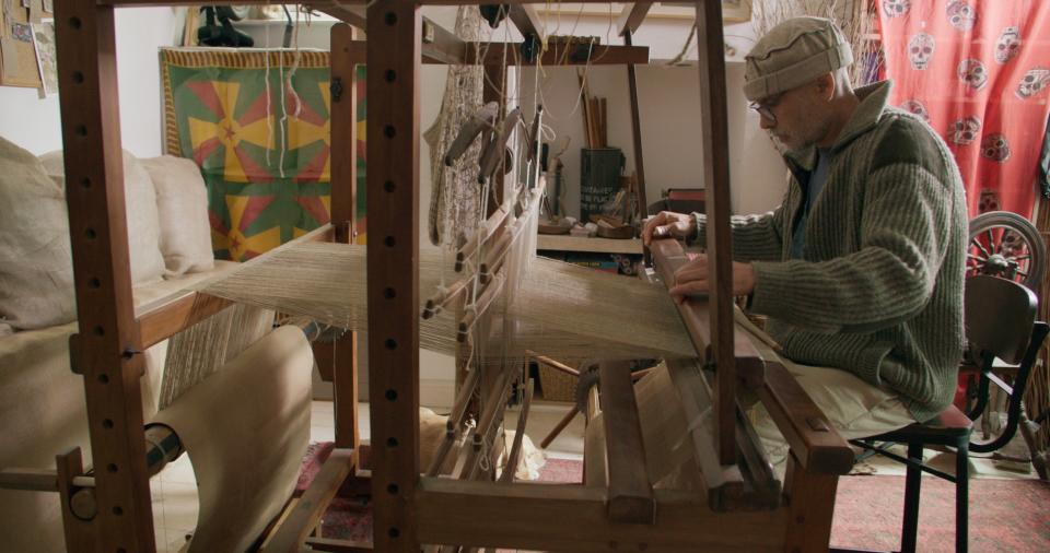 Allan Brown weaving nettles in the seven-year-process to make a dress