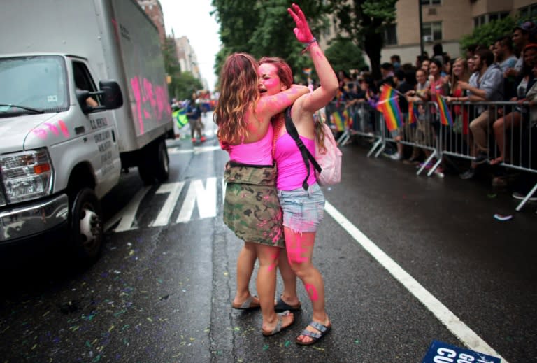 Participants hug during the Gay Pride Parade in New York, on June 28, 2015