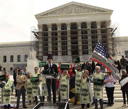 Protesters gather in front of the U.S. Supreme Court during a rally against large political donations in Washington October 8, 2013. REUTERS/Gary Cameron