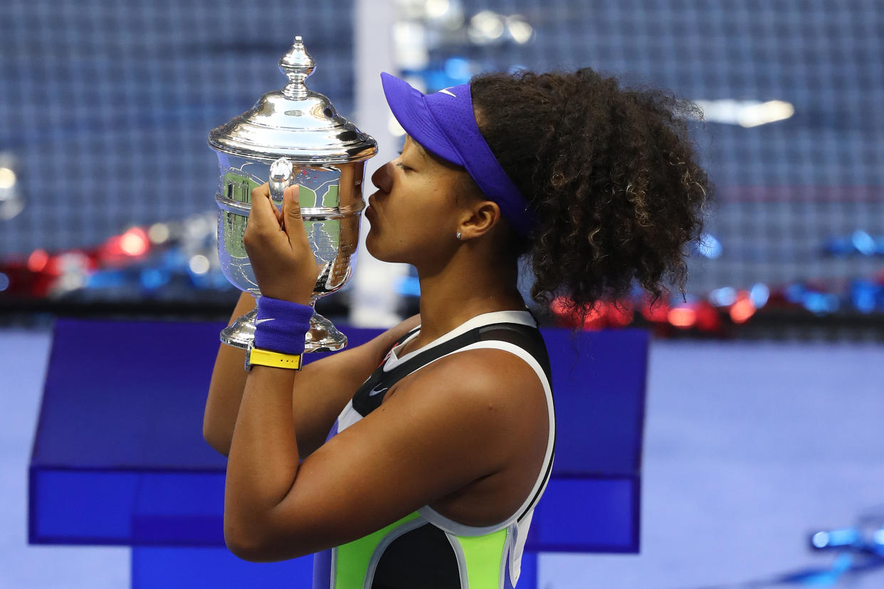 NEW YORK, NEW YORK - SEPTEMBER 12: Naomi Osaka of Japan kisses the trophy in celebration after winning her Women's Singles final match against Victoria Azarenka of Belarus on Day Thirteen of the 2020 US Open at the USTA Billie Jean King National Tennis Center on September 12, 2020 in the Queens borough of New York City. (Photo by Matthew Stockman/Getty Images)