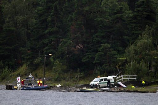 Police and emergency services search the waters around Utoeya island for more victims after Anders Behring Breivik's attack last July