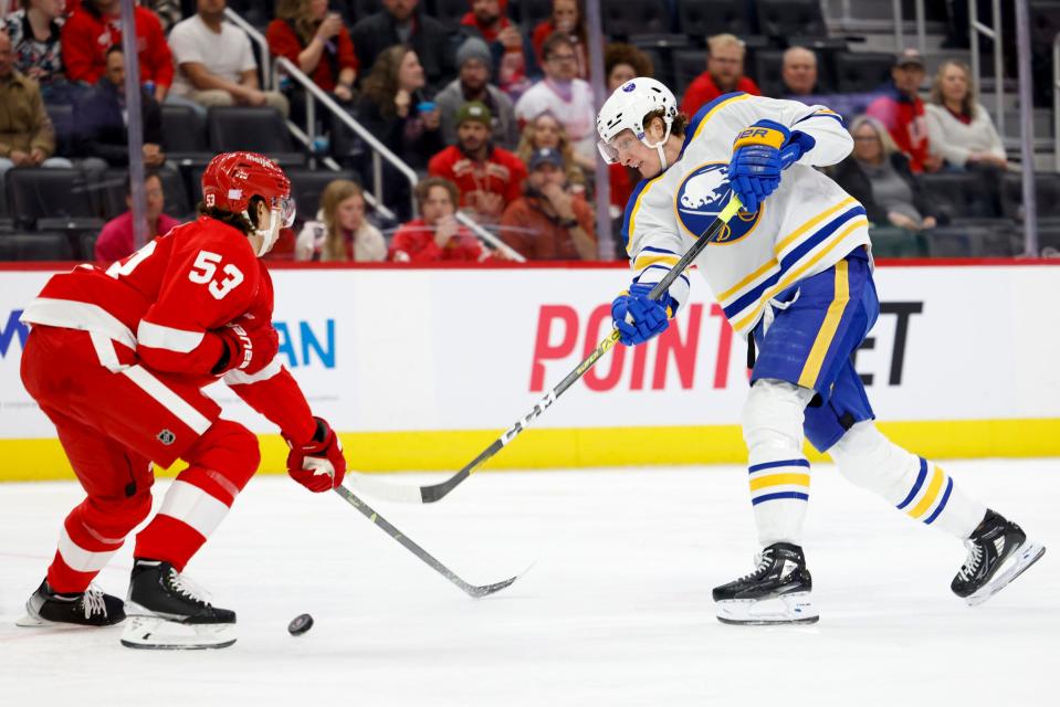 Sabres right wing Tage Thompson takes a shot defended by Red Wings defenseman Moritz Seider in the first period on Wednesday, Nov. 30, 2022, at Little Caesars Arena.