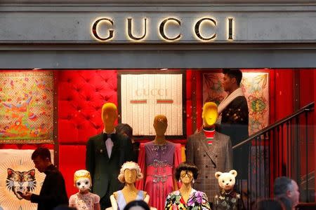 A Gucci sign is seen outside a shop in Paris, France, December 18, 2017. REUTERS/Charles Platiau/Files