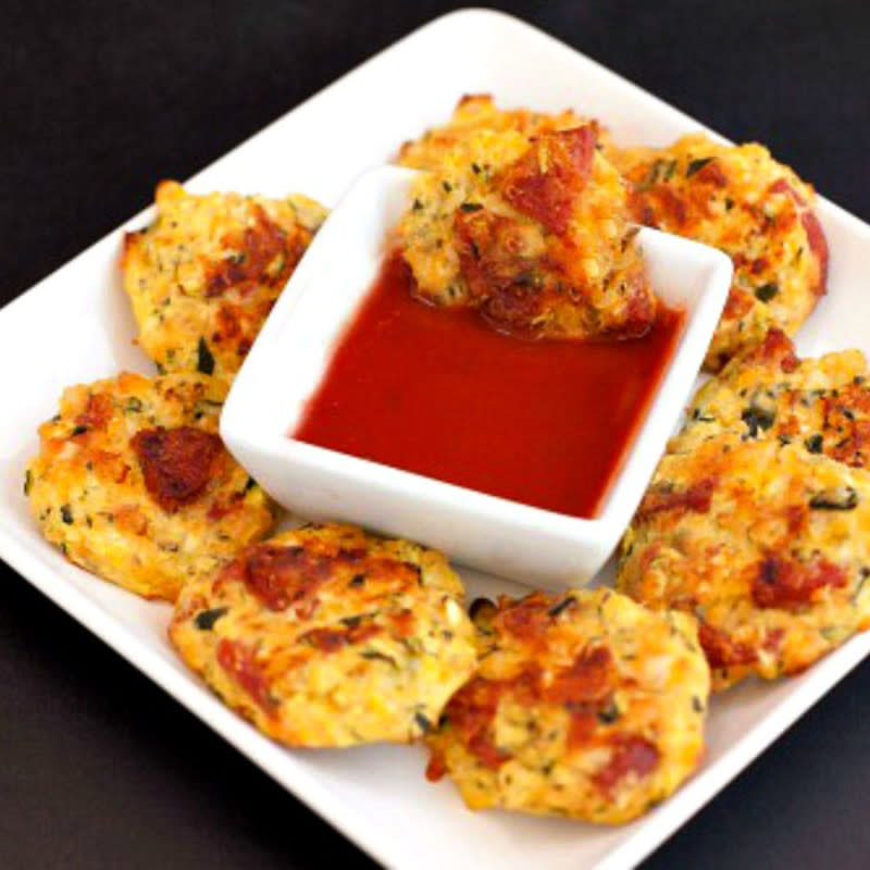 <p>Beauty and The Foodie</p><p>A low-carb snack with a big pizza taste! Easy to make, bake and serve with a dip.</p><p><strong>Get the recipe: <a href="https://beautyandthefoodie.com/easy-pizza-zucchini-tots-low-carb/" rel="nofollow noopener" target="_blank" data-ylk="slk:Easy Pizza Zucchini Tots;elm:context_link;itc:0;sec:content-canvas" class="link ">Easy Pizza Zucchini Tots </a></strong></p><p><strong>Related: <a href="https://parade.com/1361740/kristamarshall/baked-zucchini-recipes/" rel="nofollow noopener" target="_blank" data-ylk="slk:40 Best Baked Zucchini Recipes;elm:context_link;itc:0;sec:content-canvas" class="link ">40 Best Baked Zucchini Recipes</a></strong></p>