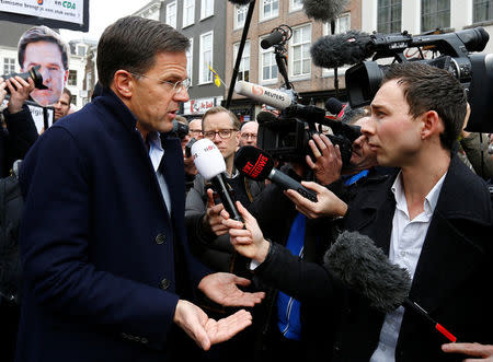 Dutch Prime Minister Mark Rutte of the VVD Liberal party speaks to the media as he campaigns for the 2017 Dutch election in Breda, Netherlands March 11, 2017. REUTERS/Michael Kooren