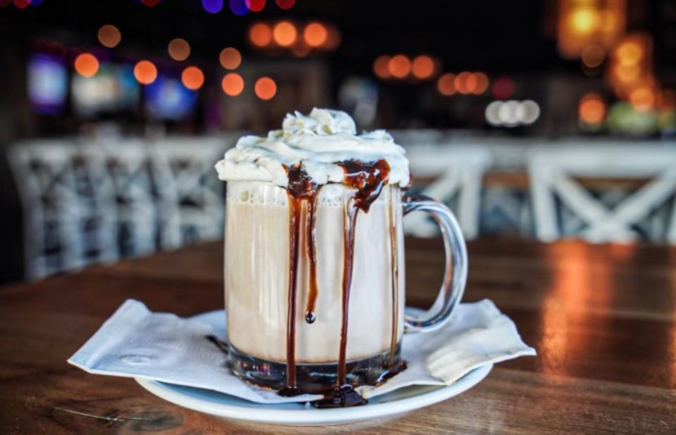 The Jack O' Lantern hot chocolate with dark rum, hot milk, chocolate syrup and pumpkin creme liqueur, topped with whipped cream and Count Chocula cereal, from Deal Lake Bar + Co. in Loch Arbour.