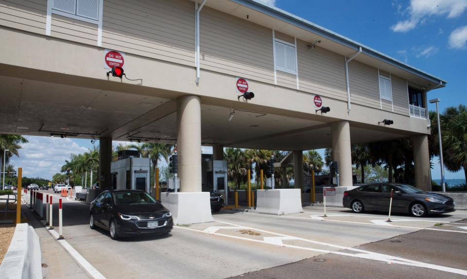 Traffic streams through the Sanibel Causeway toll booth on Wednesday, June 9, 2021.  Lee County will make all-electronic toll collection permanent.