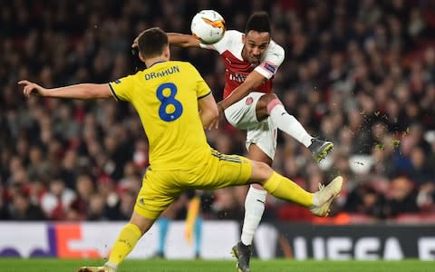 Arsenal's Gabonese striker Pierre-Emerick Aubameyang (R) has this shot blocked by BATE Borisov's Belarusian midfielder Stanislav Dragun (L) during the UEFA Europa League round of 32, 2nd leg football match between Arsenal and Bate Borisov at the Emirates stadium in London on February 21, 2019 - Credit: AFP