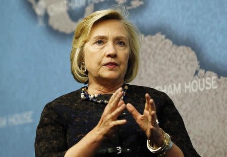 Former U.S. Secretary of State Hillary Clinton speaks at Chatham House in central London, October 11, 2013. REUTERS/Olivia Harris