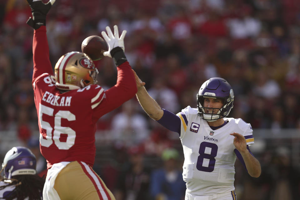 Minnesota Vikings quarterback Kirk Cousins (8) throws a pass against San Francisco 49ers defensive end Samson Ebukam (56) during the first half of an NFL football game in Santa Clara, Calif., Sunday, Nov. 28, 2021. (AP Photo/Jed Jacobsohn)