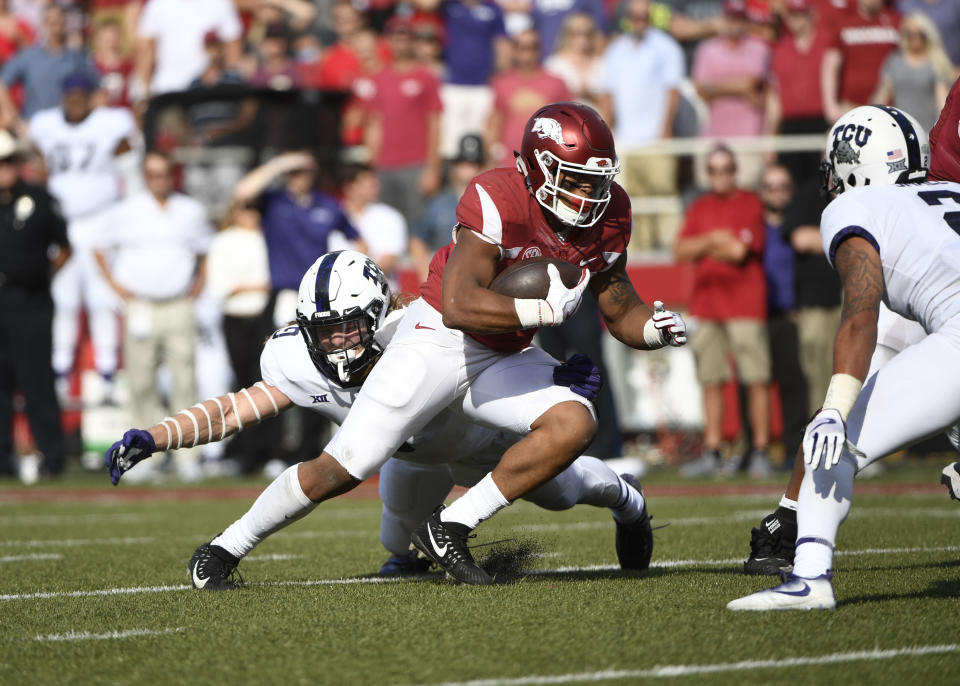 Arkansas running back Devwah Whaley is tackled by TCU defender Mat Boesen just short of the goal line in the second half of an NCAA college football game in Fayetteville, Ark., Saturday, Sept. 9 2017. AP Photo/Michael Woods)