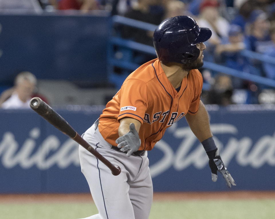 Houston Astros' Abraham Toro watches his two-run home run against the Toronto Blue Jays in the ninth inning of a baseball game in Toronto, Sunday, Sept. 1, 2019. (Fred Thornhill/The Canadian Press via AP)