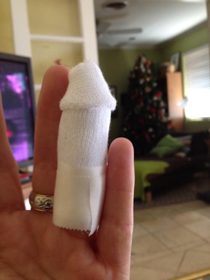 I posted this picture of my doctor's bandaging handiwork from when I sliced off the tip of my finger eight years ago on Facebook. My friend John gave me a hard time for my Christmas tree still being up.