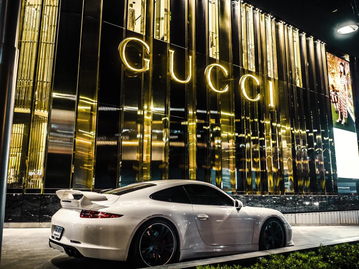 Bangkok, Thailand - February 21, 2016: Porsche car parked in front of the Gucci shop at the luxury mall Central Embassy in Bangkok Thailand