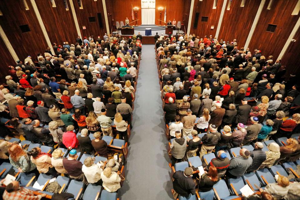 Attendees pray during the Interfaith Memorial Service for the Victims of the Tragedy that happened at the Tree of Life Synagogue in Pittsburgh, Pennsylvania.  The service was held at the Tifereth Israel Synagogue in New Bedford.