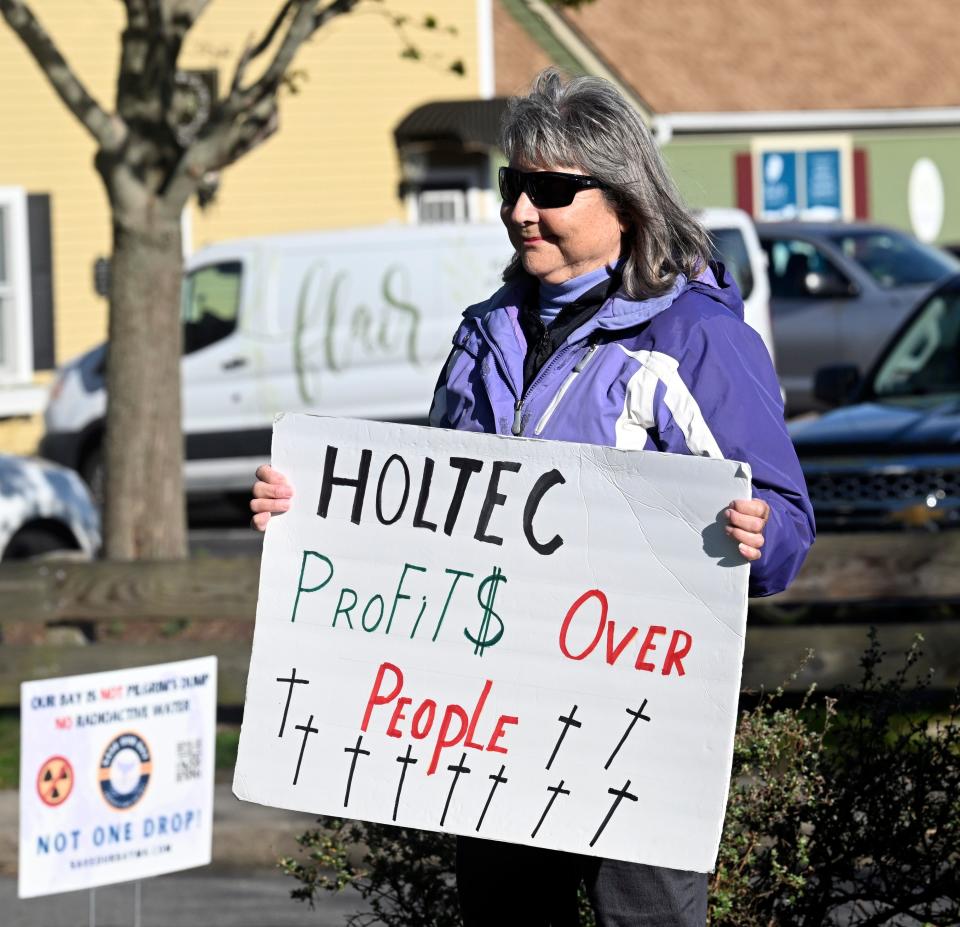 A sign held by Joanne Corrigan of Plymouth before the NRC hearing in Plymouth expressed the sentiments of demonstrators.