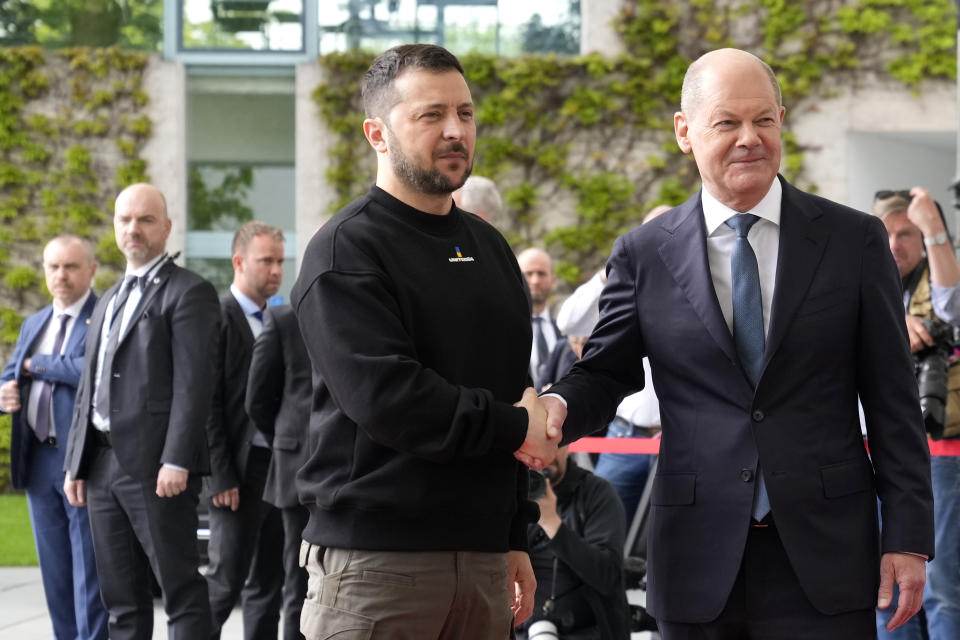 Germany's Chancellor Olaf Scholz, right, greets Ukraine's President Volodymyr Zelenskyy at the chancellery in Berlin, Germany, Sunday, May 14, 2023. Ukrainian President Volodymyr Zelenskyy arrived in Berlin early Sunday for talks with German leaders about further arms deliveries to help his country fend off the Russian invasion and rebuild what's been destroyed by more than a year of devastating conflict. (AP Photo/Matthias Schrader)