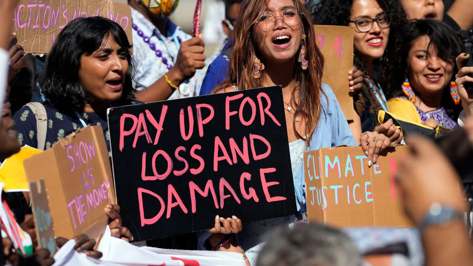 Mitzi Jonelle Tan, of the Philippines, center, participates in a Fridays for Future protest calling for money for climate action at the COP27 in Sharm el-Sheikh, Egypt, in 2022. - Peter Dejong/AP/File