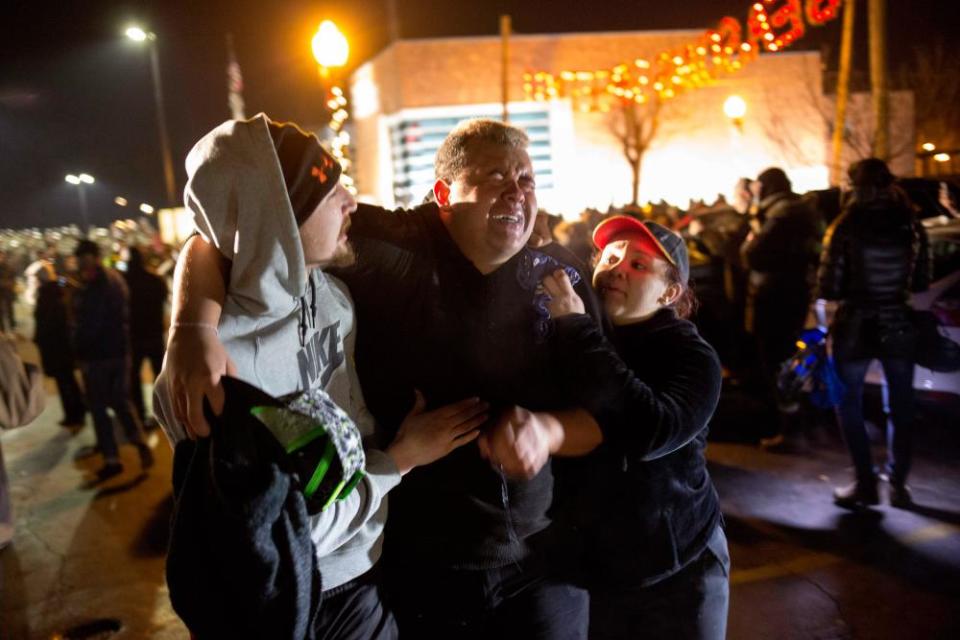 Protestors tend to an activist who was maced at a protest in Ferguson in 2014.