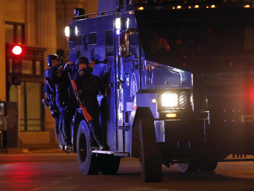 <p>Police arrive as demonstrators march in response to a not guilty verdict in the trial of former St. Louis police officer Jason Stockley, Sunday, Sept. 17, 2017, in St. Louis. Stockley was acquitted in the 2011 killing of a black man following a high-speed chase. (Photo: Jeff Roberson/AP) </p>